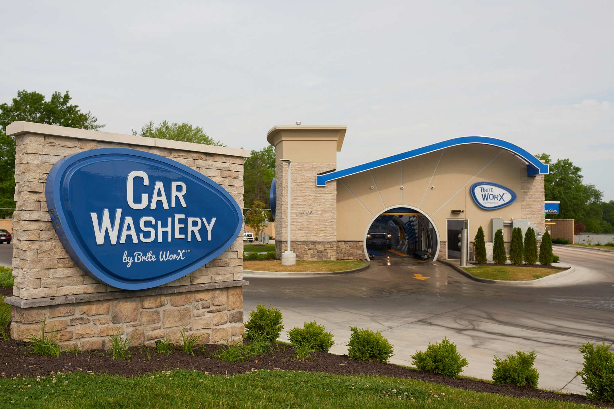 A Brite WorX Car Washery seen from the road, its Car Washery sign in the foreground